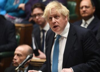 A handout photograph taken and released by the UK Parliament shows Britain’s Prime Minister Boris Johnson reacting and speaking during a Prime Minister’s Questions (PMQs) session in the House of Commons, in London, on February 23, 2022. (Photo by JESSICA TAYLOR / UK PARLIAMENT / AFP) /