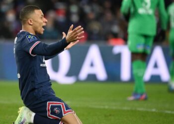 Paris Saint-Germain’s French forward Kylian Mbappe reacts during the French L1 football match between Paris-Saint Germain (PSG) and Saint-Etienne (ASSE) at The Parc des Princes Stadium in Paris on February 26, 2022. (Photo by FRANCK FIFE / AFP)