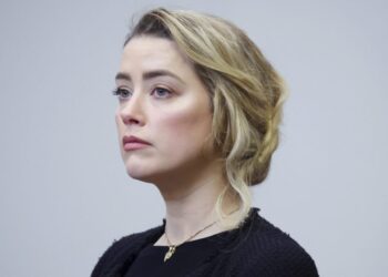 Actor Amber Heard arrives in the courtroom at the Fairfax County Circuit Court in Fairfax, Va., Thursday, April 28, 2022. Actor Johnny Depp sued his ex-wife actor Amber Heard for libel in Fairfax County Circuit Court after she wrote an op-ed piece in The Washington Post in 2018 referring to herself as a “public figure representing domestic abuse.” (Michael Reynolds/Pool Photo via AP)