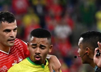 Brazil’s forward #18 Gabriel Jesus (C) argues with Slovenian referee Ivan Barton during the Qatar 2022 World Cup Group G football match between Brazil and Switzerland at Stadium 974 in Doha on November 28, 2022. (Photo by Anne-Christine POUJOULAT / AFP)