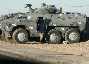 Jordanian security forces deploy their armoured vehicles in the southern city of Maan, some 220 kms south of the capital Amman, on December 16, 2022 hours after a senior police officer was shot dead in riots during a strike against rising fuel prices in the area. – Gunfire killed a senior Jordanian officer and wounded two other policemen last night in the country’s south, where protesters have taken to the streets for days against high fuel prices, according to the Jordanian authorities. (Photo by Khalil MAZRAAWI / AFP)