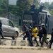 [FILE] Anti-riots policemen detain a protester during a demonstration at Ojota in Lagos on June 12, 2021 (Photo by PIUS UTOMI EKPEI / AFP)