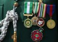 [FILE] Medals of Honour are seen on a soldier at the National Military Arcade during the commemoration of Armed Forces Remembrance Day in Abuja, Nigeria on January 15, 2022. (Photo by Kola SULAIMON / AFP)