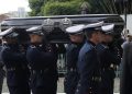 The coffin of the late Brazilian football star Pele is transported to the Santos’ Memorial Cemetery after the funeral procession in Santos, Sao Paulo state, Brazil on January 3, 2023. – Brazilian football legend Pele’s remains arrived Tuesday at the cemetery where he will be interred in a mausoleum, after three days of national mourning, a 24-hour wake and a massive funeral procession. Pele’s casket, draped in the Brazilian flag and that of his longtime club, Santos FC, arrived atop a red firetruck at the Santos Memorial Cemetery, near the stadium where “The King” began his rise to become what many consider the greatest footballer of all time. (Photo by CAIO GUATELLI / AFP)