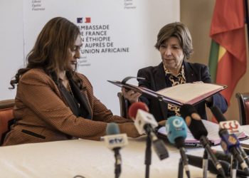 French Foreign and European Affairs Minister, Catherine Colonna (R) and Semerita Sewasew (L), Ethiopia State Minister of Finance shake hands during a signing ceremony between the Ethiopian and French government at the Embassy of France in Addis Ababa, Ethiopia, on January 13, 2023. (Photo by Amanuel Sileshi / AFP)