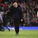 Manchester City’s Spanish manager Pep Guardiola reacts after the English Premier League football match between Manchester United and Manchester City at Old Trafford in Manchester, north west England, on January 14, 2023. (Photo by Oli SCARFF / AFP) /