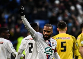 Lyon’s French forward Alexandre Lacazette celebrates after scoring a goal during the French Cup round of 32 football match between Chambery Savoie Football and Olympique Lyonnais (OL) at the Groupama Stadium in Decines-Charpieu on January 21, 2023. (Photo by OLIVIER CHASSIGNOLE / AFP)