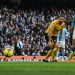 Manchester City’s Norwegian striker Erling Haaland shoots and scores his team third goal during the English Premier League football match between Manchester City and Wolverhampton Wanderers at the Etihad Stadium in Manchester, north west England, on January 22, 2023. (Photo by Paul ELLIS / AFP)