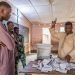 Members of the observers and the CENA (Commission Electorale Nationale Autonome) check the number of votes following the legislative elections at the public primary school, Charles Guillot de Zongo in Cotonou on January 8, 2023. – Benin voted for a new parliament on January 8, 2023 with opposition candidates authorised to stand in the legislative elections for the first time under President Patrice Talon after four years of absence. (Photo by Yanick Folly / AFP)