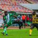 A Nigerian player being blocked by a Ghanaian defender during the Algeria 2023 CHAN Tournament qualifier in Abuja last year