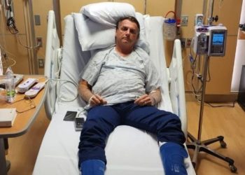 This handout photo obtained from the twitter account of Brazil’s President Jair Bolsonaro (@jairbolsonaro), shows Brazil’s former President Jair Bolsonaro on his hospital bed in Kissimmee, Florida, on January 9, 2023. – Brazilian security forces cleared protest camps Monday and arrested 1,500 people as President Luiz Inacio Lula da Silva condemned “acts of terrorism” after a far-right mob stormed the seat of power, unleashing chaos on the capital. (Photo by – / Jair Bolsonaro’s official Twitter account / AFP) /