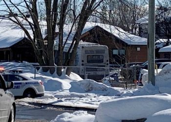 Laval, Canada, Police secure the scene where a city bus (C) crashed into a day care center on February 8, 2023. – At least two children were killed Wednesday when the bus rammed into a day care center in a suburb of Montreal, police said, adding that the driver had been arrested on suspicion of homicide. The other six children transported to hospital “are out of danger,” said Erika Landry, a police spokeswoman in Laval, where the day care is located. “The driver, a 51-year-old man, was arrested for homicide and dangerous driving,” she told reporters at the scene. (Photo by Anne-Sophie THILL / AFP)