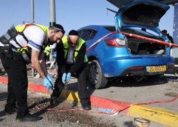 Israeli Zaka volunteers, an ultra-Orthodox Jewish emergency response team in Israel, work at the scene of a reported ramming attack in Jerusalem on February 10, 2023. – Six people, including two children, were injured when a car crashed into a bus stop in east Jerusalem, Israeli medics said, in what police called a “suspected ramming attack”. (Photo by AHMAD GHARABLI / AFP)