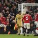 Manchester United’s Brazilian midfielder Antony (L) celebrates after scoring his team second goal during the UEFA Europa league knockout round play-off second leg football match between Manchester United and FC Barcelona at Old Trafford stadium in Manchester, north west England, on February 23, 2023. (Photo by Oli SCARFF / AFP)