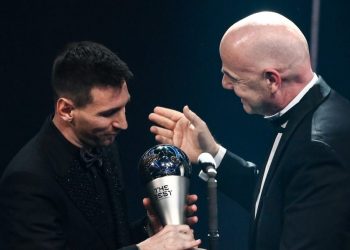 Argentina and Paris Saint-Germain forward Lionel Messi (L) receives from FIFA President Gianni Infantino the Best FIFA Mens Player award during the Best FIFA Football Awards 2022 ceremony in Paris on February 27, 2023. (Photo by FRANCK FIFE / AFP)