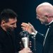 Argentina and Paris Saint-Germain forward Lionel Messi (L) receives from FIFA President Gianni Infantino the Best FIFA Mens Player award during the Best FIFA Football Awards 2022 ceremony in Paris on February 27, 2023. (Photo by FRANCK FIFE / AFP)