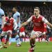 Arsenal’s Belgian midfielder Leandro Trossard celebrates scoring the opening goal during the English Premier League football match between Arsenal and Brentford at the Emirates Stadium in London on February 11, 2023. (Photo by JUSTIN TALLIS / AFP)