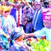 Presidential candidate of All Progressives Congress (APC), Bola Tinubu (right) receiving a bouquet from a girl during the party’s campaign rally, in Osogbo, Osun State…yesterday.