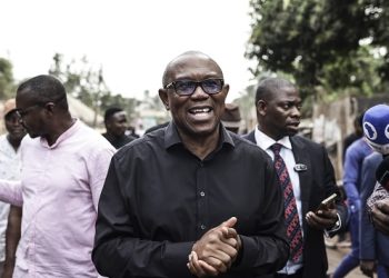 Labour Party presidential candidate Peter Obi (C) talks to the media at his house in Amatutu on February 25, 2023, before polls open during Nigeria’s presidential and general election. (Photo by Patrick Meinhardt / AFP)