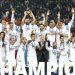 Real Madrid’s players celebrate with the trophy at the end of the FIFA Club World Cup final football match between Spain’s Real Madrid and Saudi Arabia’s Al-Hilal at the Prince Moulay Abdellah Stadium in Rabat on February 11, 2023. – Real Madrid lifted the Club World Cup for a record fifth time with a pulsating 5-3 win over Al-Hilal. (Photo by Khaled DESOUKI / AFP)