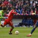 Bayern Munich’s German forward Thomas Mueller (C) scores his team’s first goal during the German first division Bundesliga football match between FC Bayern Munich and VfL Bochum 1848 in Munich, southern Germany on February 11, 2023. (Photo by MICHAELA REHLE / AFP)