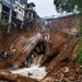 The foundation of a building on the edge of the ravine is seen following a landslide caused from heavy rains in the Caringin area, in Bogor on March 2, 2023. (Photo by ADITYA AJI / AFP)