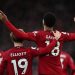 Liverpool’s Dutch striker Cody Gakpo (C) celebrates with Liverpool’s English midfielder Harvey Elliott (L) after scoring the opening goal of the English Premier League football match between Liverpool and Manchester United at Anfield in Liverpool, north west England on March 5, 2023. (Photo by Paul ELLIS / AFP)