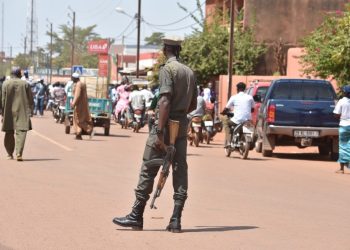 (FILES) In this file photo taken on October 29, 2018 shows a policeman patrolling in the center of Ouahigouya, eastern Burkina Faso. – Between 12 and 14 people were killed last week in northern Burkina Faso, a region that has been battered by jihadist insurgents, local inhabitants said on March 6, 2023.”A group of terrorists” on March 2, 2023 attacked the village of Aorema, near the town of Ouahigouya, they told AFP. (Photo by ISSOUF SANOGO / AFP)