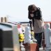 People visit a cemetery at Namie town of Fukushima Prefecture on March 11, 2023, on the 12th anniversary of the 9.0 magnitude earthquake which triggered a tsunami and nuclear disaster. (Photo by STR / JIJI PRESS / AFP) / Japan OUT / JAPAN OUT