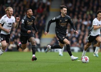 Arsenal’s Portuguese midfielder Fabio Vieira (R) runs with the ball during the English Premier League football match between Fulham and Arsenal at Craven Cottage in London on March 12, 2023. (Photo by ADRIAN DENNIS / AFP)