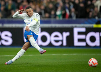 France's Kylian Mbappe scores his side's third goal during the Euro 2024 group B qualifying soccer match between France and the Netherlands at the Stade de France in Saint Denis, outside Paris, France, Friday, March 24, 2023. (AP Photo/Christophe Ena)