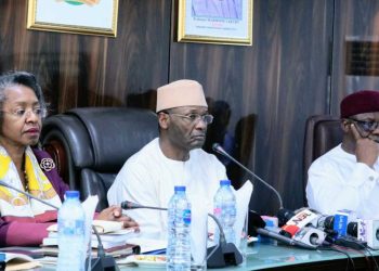 Commissioner, Independent National Electoral Commission (INEC), May Agbamuche-Mbu (left); INEC Chairman, Professor Mahmood Yakubu; and National Commissioner for Information and Voter Education, Mr. Festus Okoye, during a meeting with Resident Electoral Commissioners (RECs) on the forthcoming governorship elections on March 11, 2023 in Abuja… yesterday.