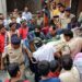 Rescue and security personnel carry a devotee on a stretcher who was injured after the floor covering a stepwell collapsed at a temple in Indore on March 30, 2023. – At least 13 devotees were killed and more than a dozen rescued on March 30 after they fell into a well at a Hindu temple in India, officials said. (Photo by – / AFP)