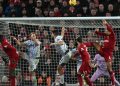 Liverpool’s Dutch defender Virgil van Dijk (R) heads at goal before scoring from the rebounded save during the English Premier League football match between Liverpool and Wolverhampton at Anfield in Liverpool, north west England on March 1, 2023. (Photo by Paul ELLIS / AFP)