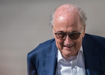 Former FIFA president Sepp Blatter reacts as he arrives to Switzerland's Federal Criminal Court to listen to the verdict of his trial over a suspected fraudulent payment, in the southern Switzerland city of Bellinzona, on July 8, 2022. - The Bellinzona court will hand down its verdict in the trial of former UEFA president Michel Platini and former FIFA president Sepp Blatter. Blatter and Platini are being tried over a two-million-Swiss-franc ($2 million) payment in 2011 to the former France captain, who by that time was in charge of European football's governing body UEFA. (Photo by Fabrice COFFRINI / AFP)