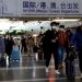 Travellers walk with their luggage at Beijing Capital International Airport, amid the coronavirus disease (COVID-19) outbreak in Beijing, China December 27, 2022. REUTERS/Tingshu Wang/File Photo