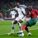 LISBON, PORTUGAL – NOVEMBER 17: Bright Osayi-Samuel of Nigeria competes for the ball with Nuno Mendes of Portugal during the friendly match between Portugal and Nigeria at Estadio Jose Alvalade on November 17, 2022 in Lisbon, Portugal. (Photo by Jose Manuel Alvarez/Quality Sport Images/Getty Images)