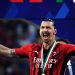 AC Milan’s Swedish forward Zlatan Ibrahimovic, holding a cigar, celebrates during the winner’s trophy ceremony after AC Milan won the Italian Serie A football match between Sassuolo and AC Milan, securing the “Scudetto” championship on May 22, 2022 at the Mapei – Citta del Tricolore stadium in Sassuolo. (Photo by Filippo MONTEFORTE / AFP)