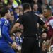 Referee Andy Madley separates Chelsea’s English defender Ben Chilwell (L) and Aston Villa’s English defender Ashley Young (R) during the English Premier League football match between Chelsea and Aston Villa at Stamford Bridge in London on April 1, 2023. (Photo by JUSTIN TALLIS / AFP)