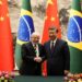 Chinese President Xi Jinping (R) and Brazil’s President Luiz Inacio Lula da Silva shake hands after a signing ceremony at the Great Hall of the People in Beijing on April 14, 2023. (Photo by Ken Ishii / POOL / AFP)