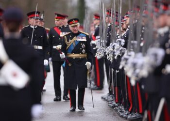 Britain’s King Charles III inspects graduating officer cadets march during the 200th Sovereign’s Parade at the Royal Military Academy, Sandhurst, southwest of London on April 14, 2023. (Photo by Dan Kitwood / POOL / AFP)