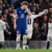 Real Madrid's Brazilian striker Rodrygo Goes (R) celebrates scoring the opening goal during the Champions League quarter-final second-leg football match between Chelsea and Real Madrid at Stamford Bridge in London on April 18, 2023. (Photo by Glyn KIRK / AFP)