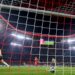 Manchester City’s Norwegian striker Erling Haaland (L) celebrates after scoring the 0-1 opening goal against Bayern Munich’s Swiss goalkeeper Yann Sommer (R) during the UEFA Champions League quarter-final, second leg football match between Bayern Munich and Manchester City in Munich, southern Germany on April 19, 2023. (Photo by CHRISTOF STACHE / AFP)