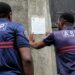 Municipal police officers placard a prefectural decree at the “Talus 2” slum in the Majicavo slope, near Koungou, in the French territory of Mayotte in the Indian Ocean, on April 21, 2023. – Called “Wuambushu”, the “secret” operation is no longer secret: France is preparing to launch a series of police interventions against delinquency and illegal immigration in Mayotte in the coming days, by carrying out massive expulsions of illegal aliens predominantly from the Comoros islands, and destroying shanty towns. (Photo by Chafion MADI / AFP)