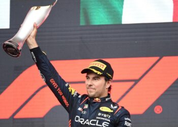 Red Bull Racing’s Mexican driver Sergio Perez celebrates with the trophy after winning the Formula One Azerbaijan Grand Prix at the Baku City Circuit in Baku on April 30, 2023. (Photo by NATALIA KOLESNIKOVA / AFP)