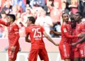 Bayern Munich's French forward Kingsley Coman (2nd R) celebrates scoring the 2-0 goal with his team-mates Bayern Munich's German midfielder Leroy Sane (C), Bayern Munich's Dutch midfielder Ryan Gravenberch (R) Bayern Munich's German forward Thomas Mueller and Bayern Munich's Portuguese defender Joao Cancelo (L) during the German first division Bundesliga football match between FC Bayern Munich and Hertha Berlin in Munich, southern Germany on April 30, 2023. (Photo by Christof STACHE / AFP) / DFL REGULATIONS PROHIBIT ANY USE OF PHOTOGRAPHS AS IMAGE SEQUENCES AND/OR QUASI-VIDEO  - DFL REGULATIONS PROHIBIT ANY USE OF PHOTOGRAPHS AS IMAGE SEQUENCES AND/OR QUASI-VIDEO