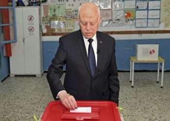 A handout picture provided by the Tunisian presidency press service shows President Kais Saied voting in a referendum on a draft constitution he put forward, at a polling station in the capital Tunis, on July 25, 2022. – The vote is seen as a referendum on Saied, whose charter would give his office nearly unchecked powers in a break with the country’s post-2011 democratic trend. (Photo by – / Tunisian Presidency / AFP) / == RESTRICTED TO EDITORIAL USE – MANDATORY CREDIT “AFP PHOTO / HO / TUNISIAN PRESIDENCY PRESS SERVICE” – NO MARKETING NO ADVERTISING CAMPAIGNS – DISTRIBUTED AS A SERVICE TO CLIENTS == – == RESTRICTED TO EDITORIAL USE – MANDATORY CREDIT “AFP PHOTO / HO / TUNISIAN PRESIDENCY PRESS SERVICE” – NO MARKETING NO ADVERTISING CAMPAIGNS – DISTRIBUTED AS A SERVICE TO CLIENTS == / ALTERNATIVE CROP