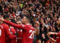 Manchester United's Portuguese midfielder Bruno Fernandes celebrates with teammates after scoring his team first goal during the English Premier League football match between Manchester United and Aston Villa at Old Trafford in Manchester, north west England, on April 30, 2023. (Photo by Oli SCARFF / AFP) / RESTRICTED TO EDITORIAL USE. NO USE WITH UNAUTHORIZED AUDIO, VIDEO, DATA, FIXTURE LISTS, CLUB/LEAGUE LOGOS OR 'LIVE' SERVICES. ONLINE IN-MATCH USE LIMITED TO 120 IMAGES. AN ADDITIONAL 40 IMAGES MAY BE USED IN EXTRA TIME. NO VIDEO EMULATION. SOCIAL MEDIA IN-MATCH USE LIMITED TO 120 IMAGES. AN ADDITIONAL 40 IMAGES MAY BE USED IN EXTRA TIME. NO USE IN BETTING PUBLICATIONS, GAMES OR SINGLE CLUB/LEAGUE/PLAYER PUBLICATIONS. - RESTRICTED TO EDITORIAL USE. No use with unauthorized audio, video, data, fixture lists, club/league logos or 'live' services. Online in-match use limited to 120 images. An additional 40 images may be used in extra time. No video emulation. Social media in-match use limited to 120 images. An additional 40 images may be used in extra time. No use in betting publications, games or single club/league/player publications. /