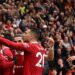 Manchester United's Portuguese midfielder Bruno Fernandes celebrates with teammates after scoring his team first goal during the English Premier League football match between Manchester United and Aston Villa at Old Trafford in Manchester, north west England, on April 30, 2023. (Photo by Oli SCARFF / AFP) / RESTRICTED TO EDITORIAL USE. NO USE WITH UNAUTHORIZED AUDIO, VIDEO, DATA, FIXTURE LISTS, CLUB/LEAGUE LOGOS OR 'LIVE' SERVICES. ONLINE IN-MATCH USE LIMITED TO 120 IMAGES. AN ADDITIONAL 40 IMAGES MAY BE USED IN EXTRA TIME. NO VIDEO EMULATION. SOCIAL MEDIA IN-MATCH USE LIMITED TO 120 IMAGES. AN ADDITIONAL 40 IMAGES MAY BE USED IN EXTRA TIME. NO USE IN BETTING PUBLICATIONS, GAMES OR SINGLE CLUB/LEAGUE/PLAYER PUBLICATIONS. - RESTRICTED TO EDITORIAL USE. No use with unauthorized audio, video, data, fixture lists, club/league logos or 'live' services. Online in-match use limited to 120 images. An additional 40 images may be used in extra time. No video emulation. Social media in-match use limited to 120 images. An additional 40 images may be used in extra time. No use in betting publications, games or single club/league/player publications. /