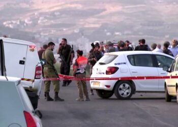 Members of Israeli forces gather at the scene of a shooting incident in the Israeli-occupied West Bank May 2, 2021, in this still image taken from a video. REUTERS/REUTERS TV